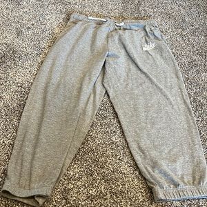 Nike crop sweats with pockets. These are a lighter fabric. Drawstring waistband.